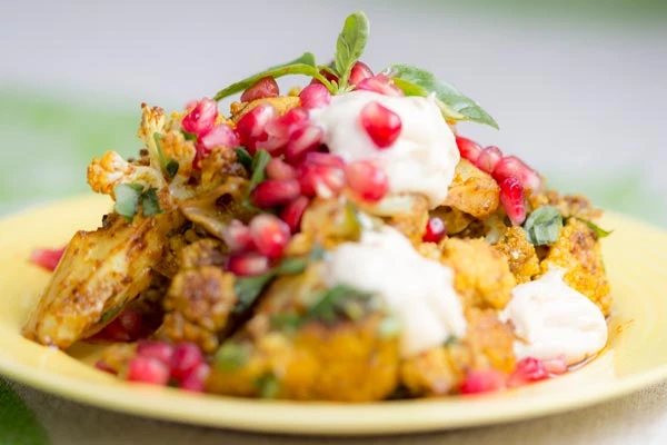 Spiced cauliflower with pomegranate and tahini